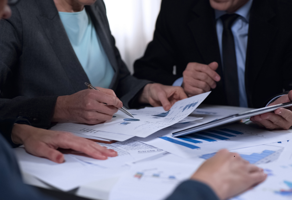 Image of people working together at a desk