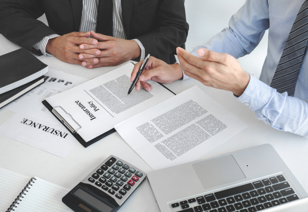 Image of people reviewing insurance documents