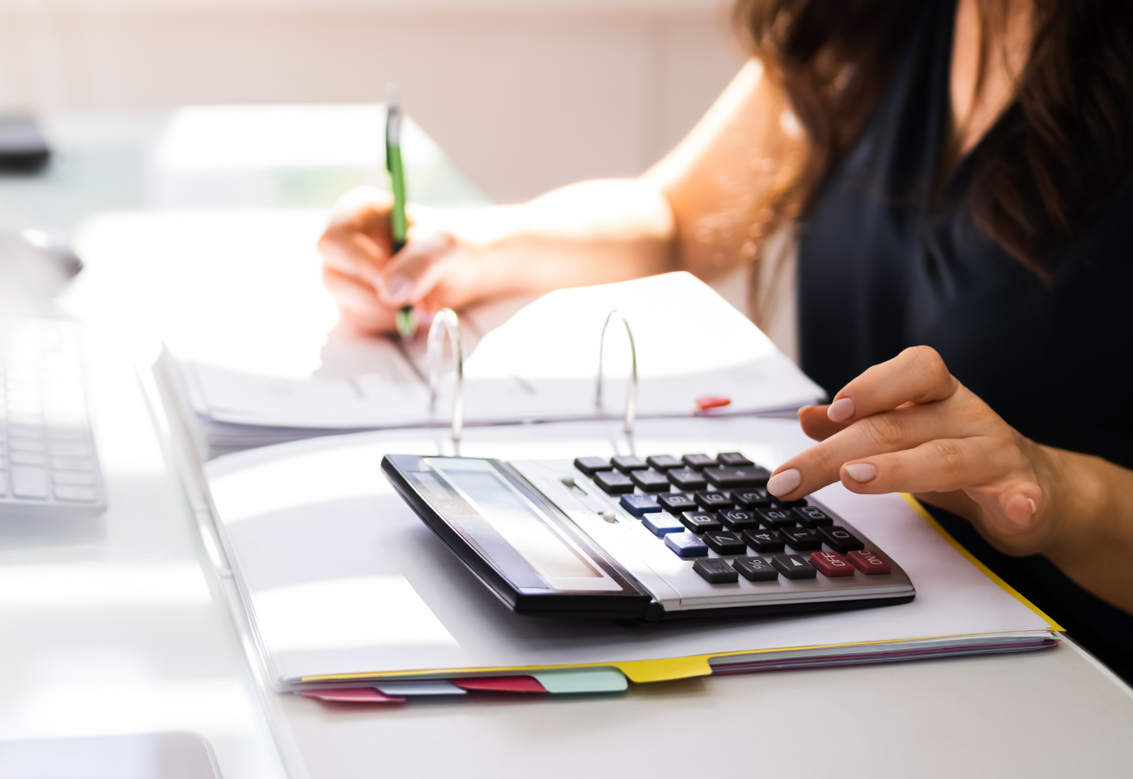 Image of a person using a calculator