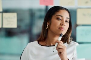 Image of a person holding a pen