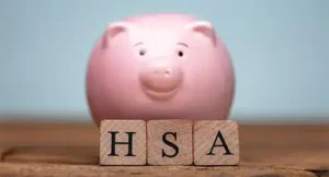 Image of a piggy bank and letter blocks reading "HSA"